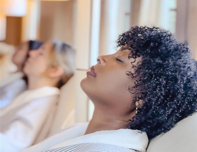 woman rests in the relaxation lounge