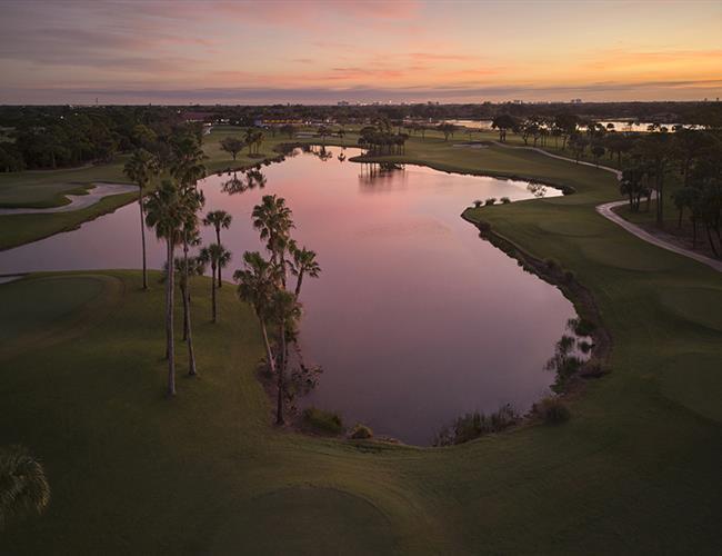 An aerial shot of a lake in a golf course