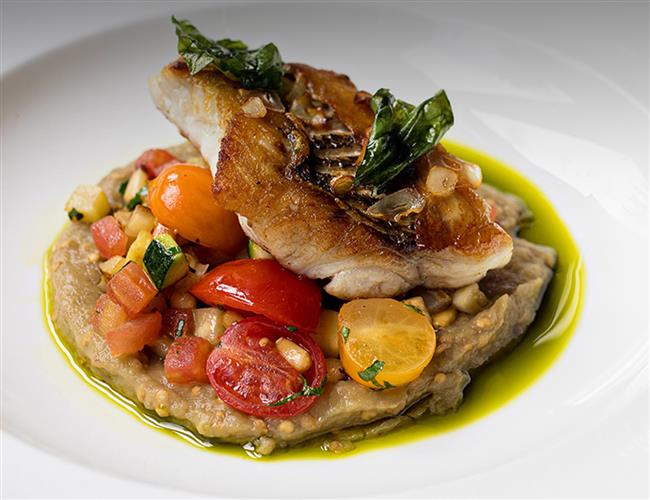 A chicken dish with tomatoes