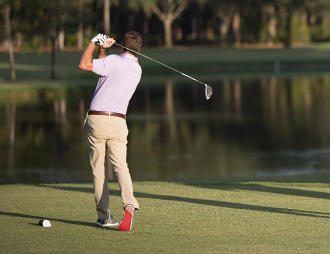 Golfer taking a swing at Innisbrook Golf Course