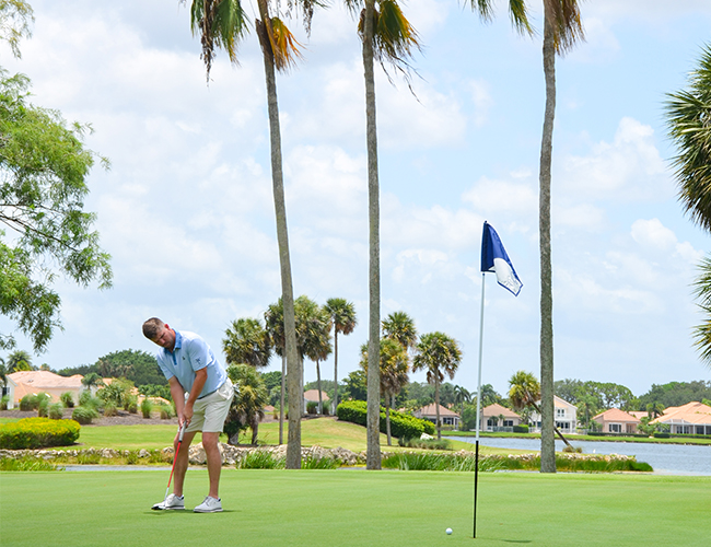 golfer putting at PGA National