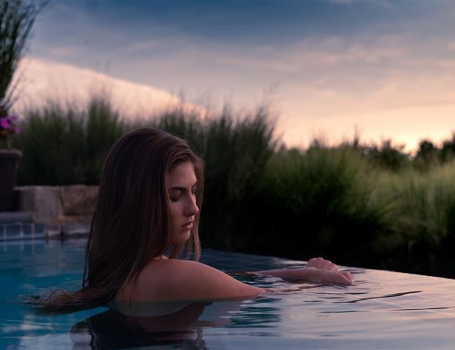 Woman in infinity pool