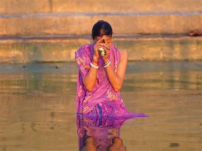 woman praying in water