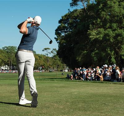man golfing in tornament 