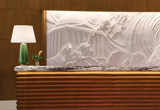 marble art above lobby desk