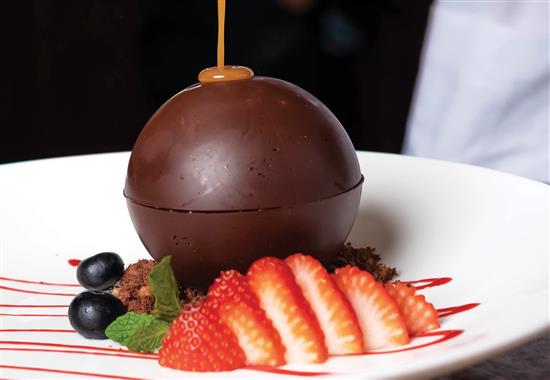 dessert caramel drizzle on top of chocolate truffle