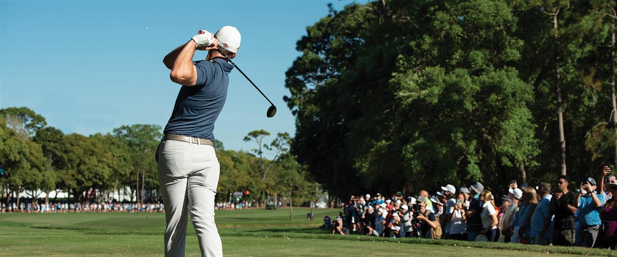 man golfing in tournament
