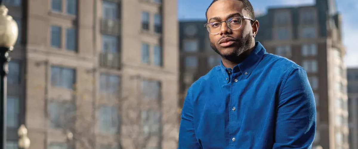 Kwame in a blue shirt