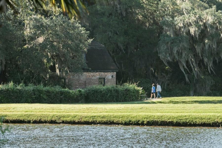 People walking along a river