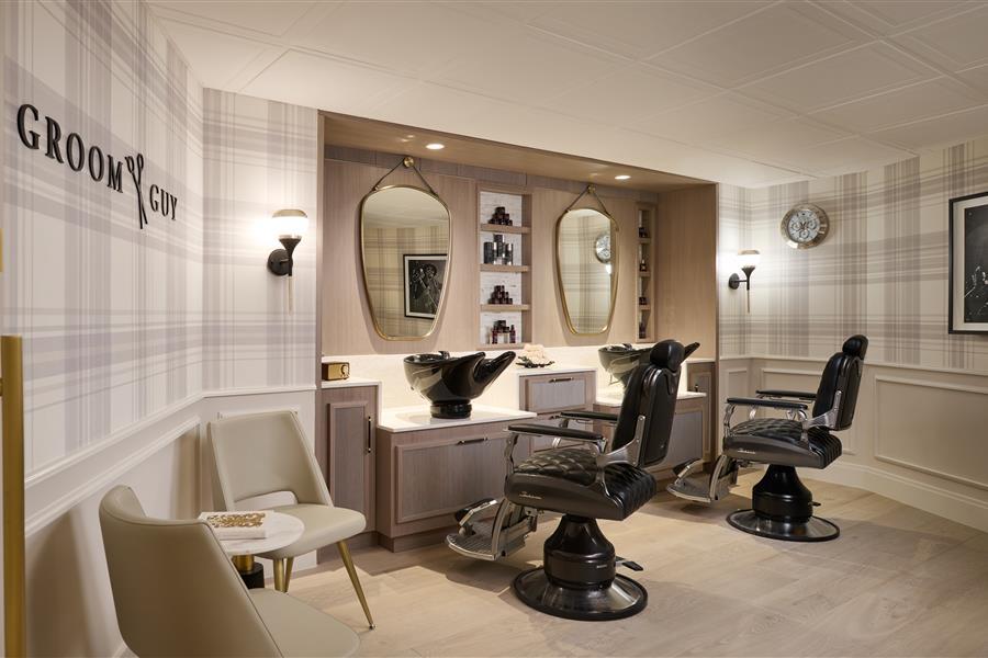 Grooming chairs set up in front of mirrors