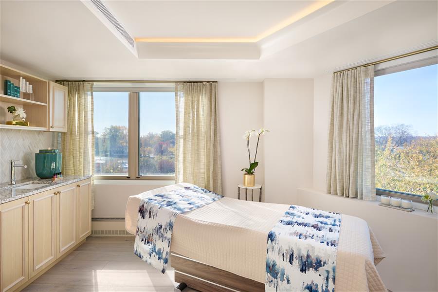 Massage table in a brightly lit room by natural sunlight