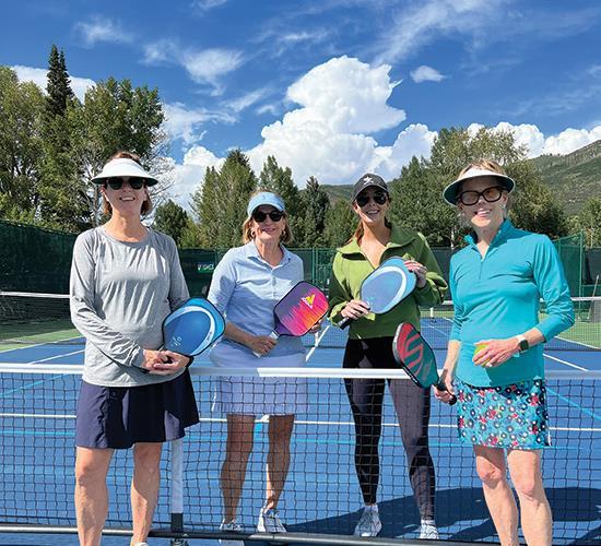 women playing pickleball
