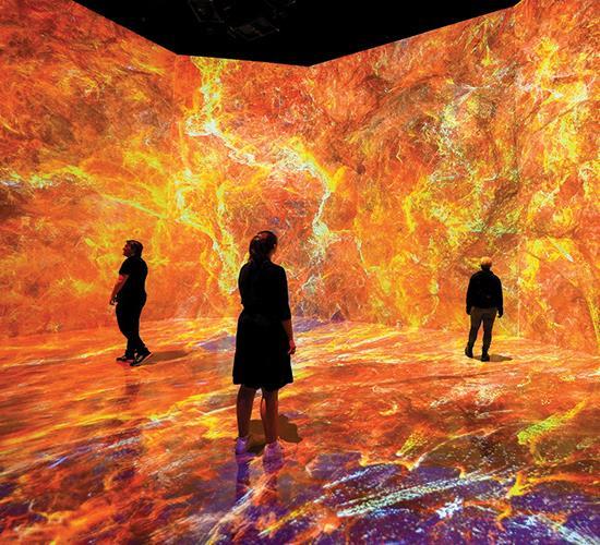 people walking through space exhibit