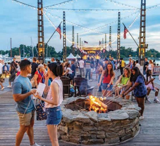 people celebrating 4th of July on the harbor