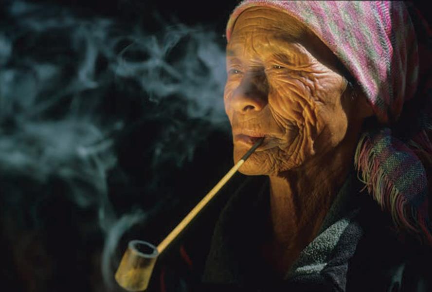 woman smoking pipe