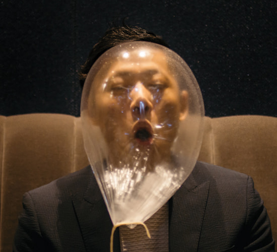 Guest enjoying a playful dessert at Alinea