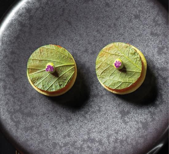 raw ocean trout on rice crackers with shisho and wasabi