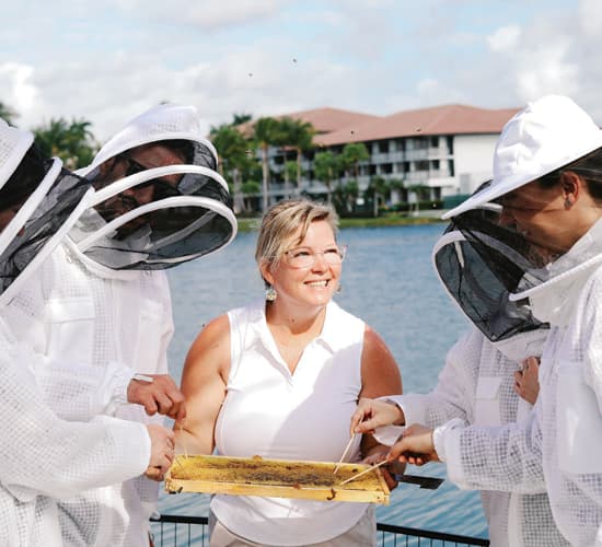 Professional beekeeper Sierra Malnove interacts with guests at PGA National Resort's Bee Experience.