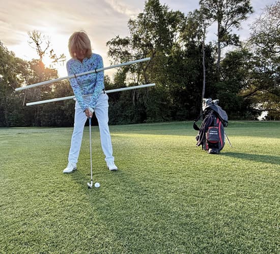 Dawn Mercer, Director of Instruction at Innisbrook Resort, shows how to address an uphill lie