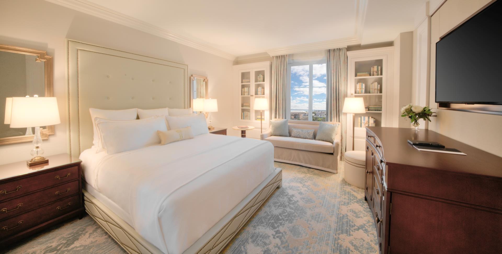 Hotel room with a bed and small couch