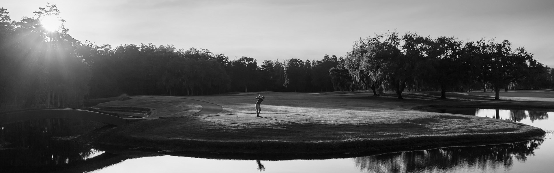 Man golfing on course