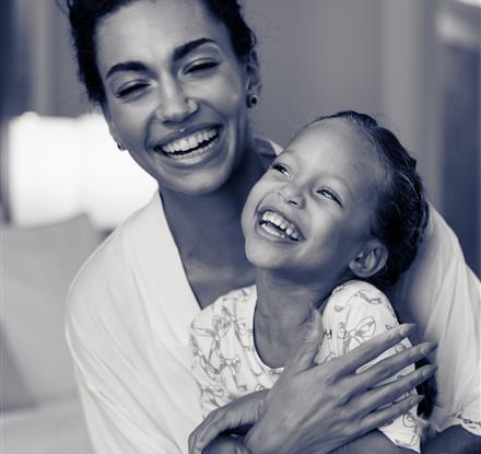 Mother and daughter laughing