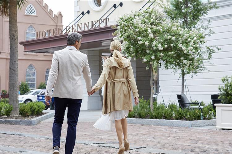 couple walking by Hotel Bennett