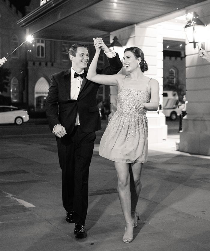 Couple leaving hotel