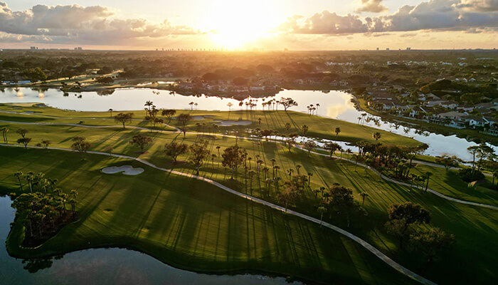 PGA National Resort golf course aerial near sunset with long shadows
