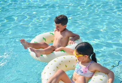 children playing poolside