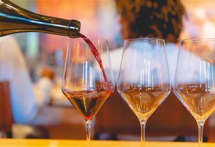 Wine pouring into glasses