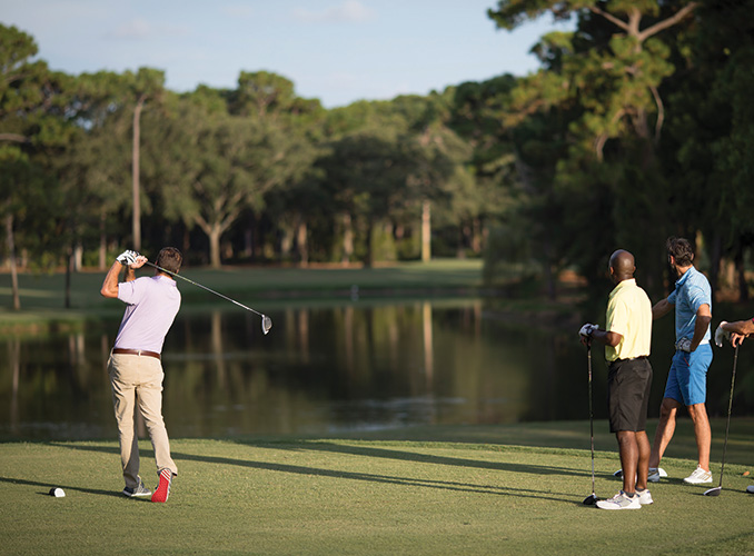 friends playing golf