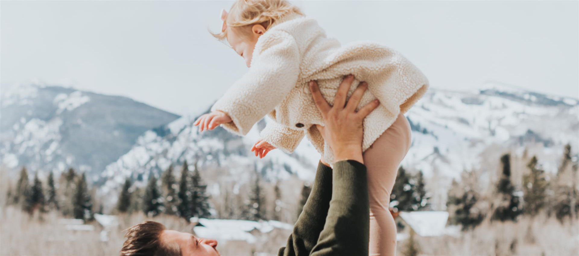 baby being tossed in air