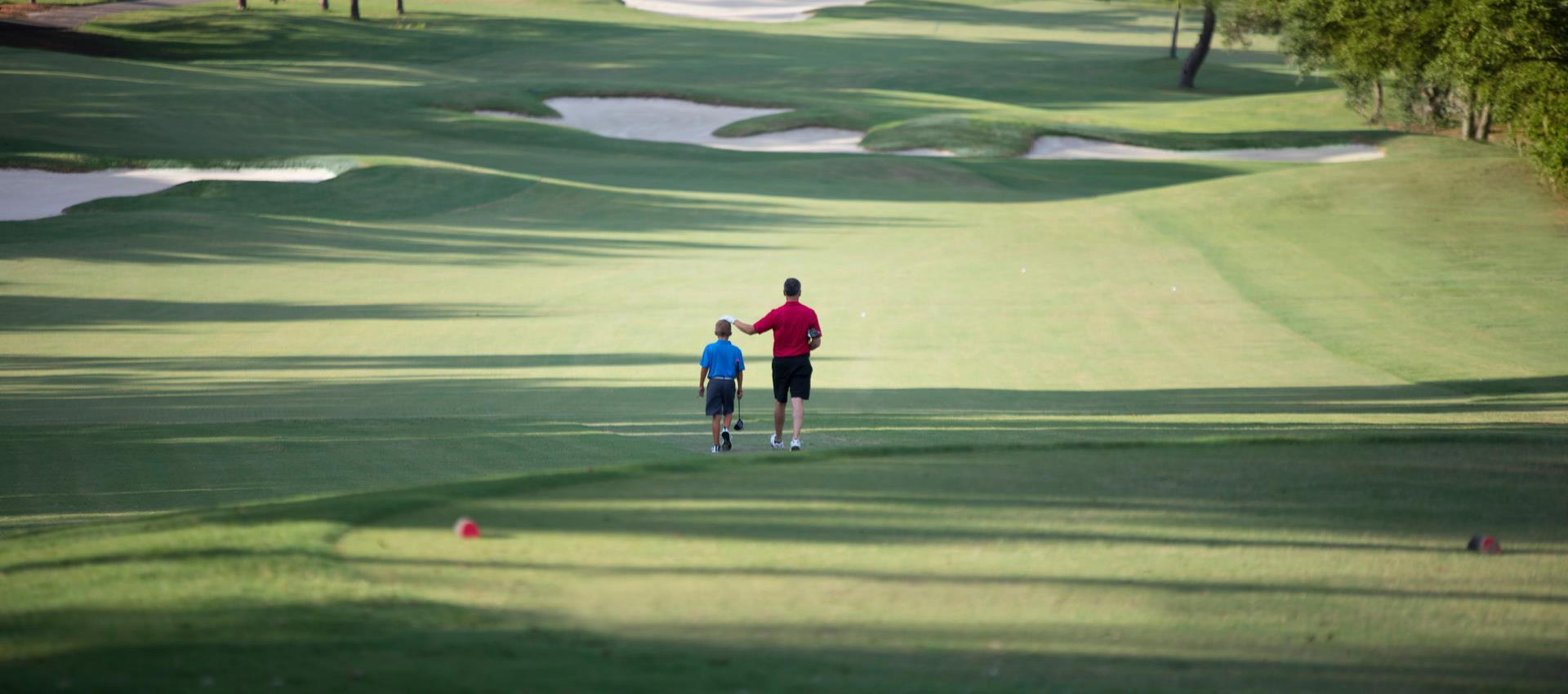 father and son golfing