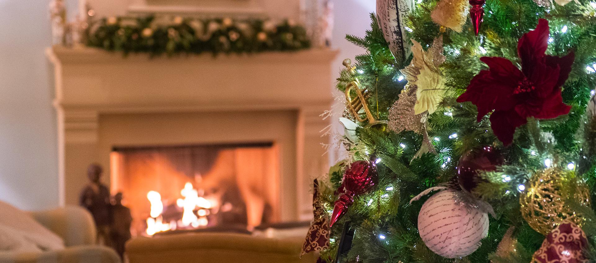 christmas tree near fireplace