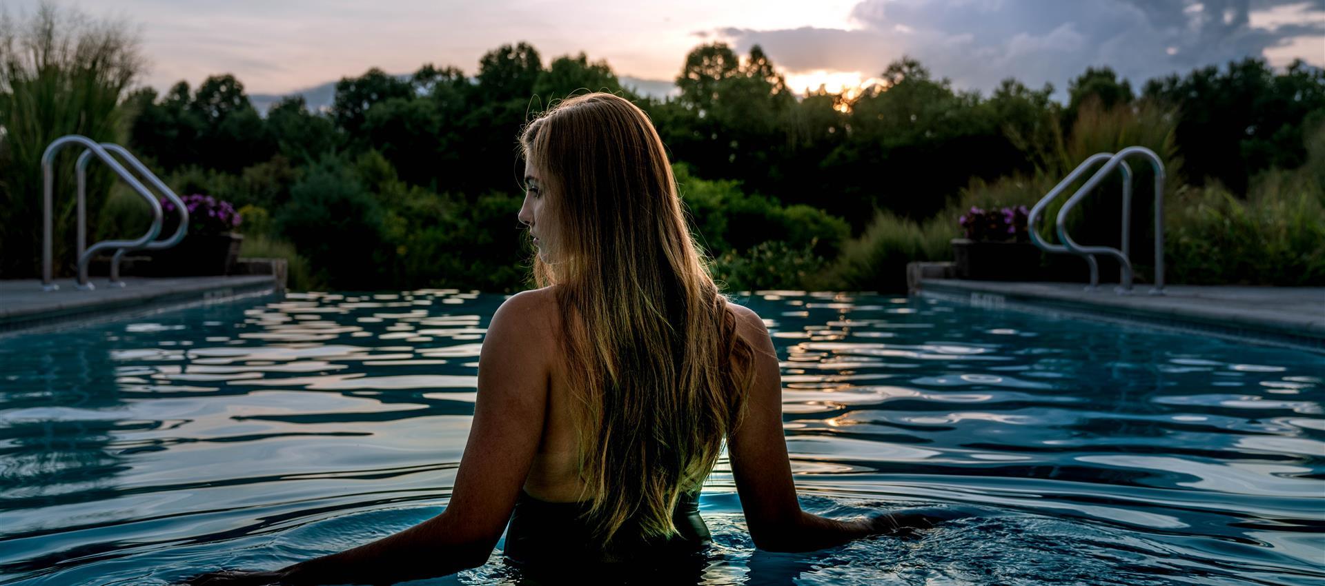 A woman standing in Salamander Middleburg Pool